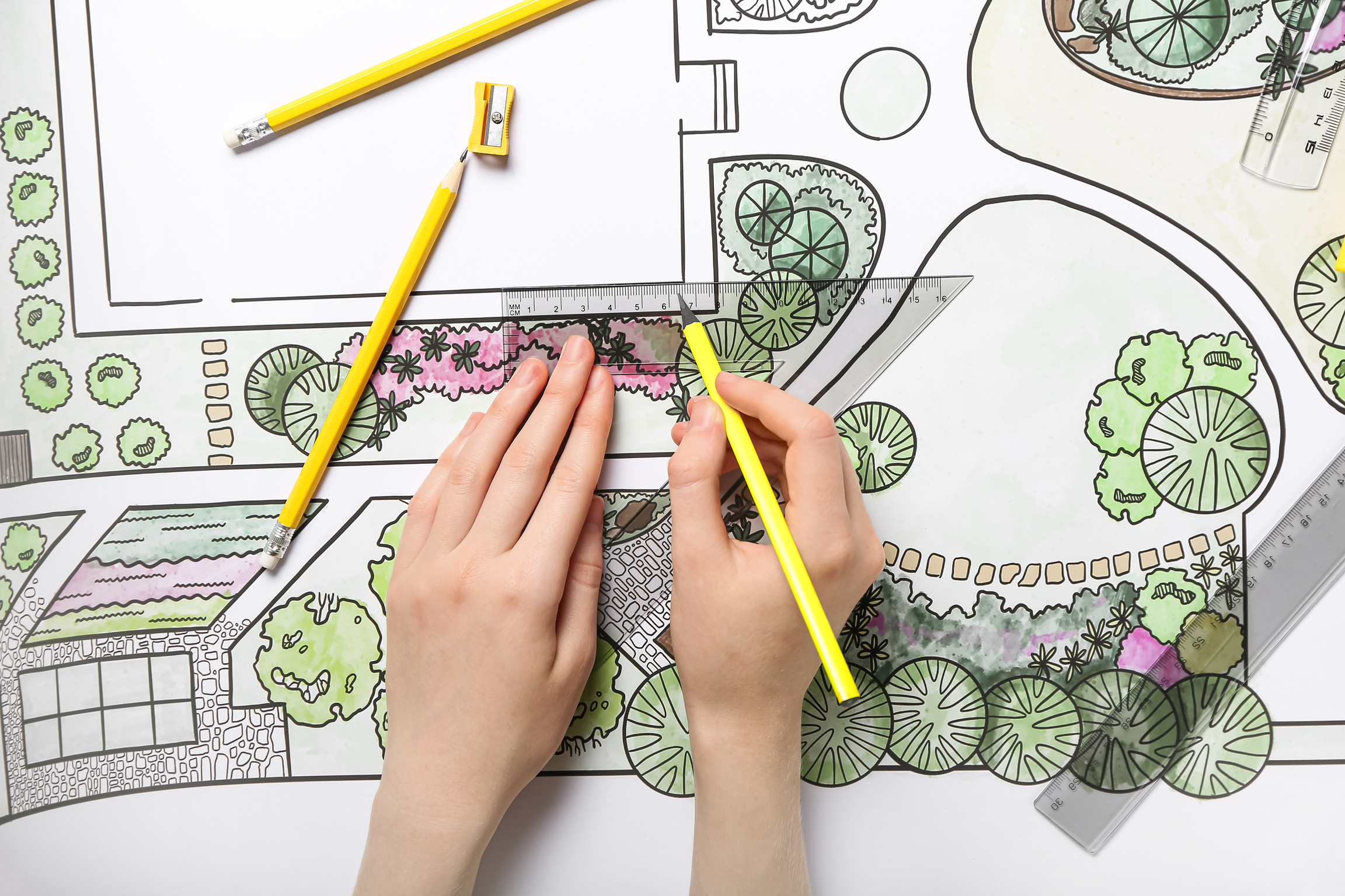 Landscape Designer Drawing on Plan of Garden